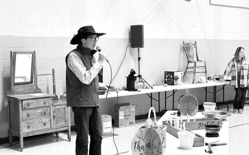 Kade Conner was the auctioneer for the live auction at the Prairie Parish Fall Festival on Sunday, November 5 at Timber Lake. The event also included a ham and turkey dinner with all the trimmings, a bake sale and a silent auction. Prairie Parish is made up of the United Parish of Timber Lake and the UCC at Isabel. Photo by Kathy Nelson