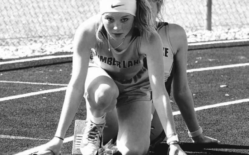 Timber Lake’s Kenlea Heck stays focused on the track ahead of her as she lines up for the start of the 800 meter relay during recent track meet action. Heck and teammates Arianna Bieber, Sara Keller and Kiya Mowrer won the LMC title in the event on Monday in Lemmon. Courtesy Photo