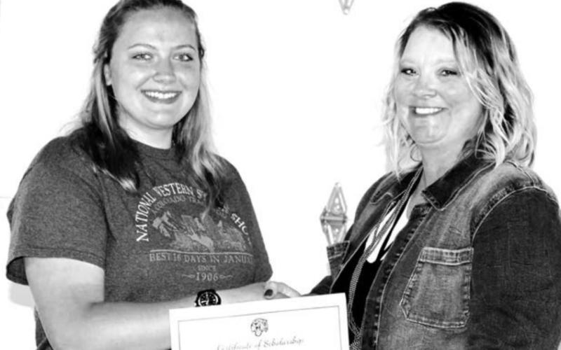 The only representative from the DHS Class of 2022, and the recipient of this year’s senior scholarship, Erin Lemke (LEFT), accepted the award from DHS Alumni Board member Robyn DePoy.