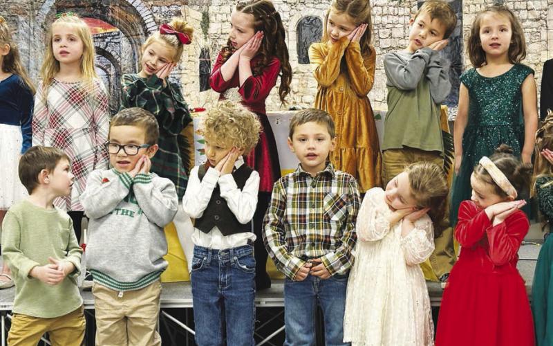 Singers at the Holy Cross Christmas program included (front, l-r): Koleson Long, Ryker Bridges, Cayn Gill, Zeke Vogel; back: Elsie Maher, Rowan Maher, Bexley Dupris, Joey Kraft.