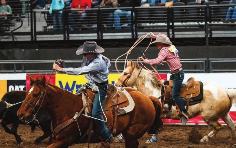Rope Roghair and Sage Burress of Isabel win the team roping at the Wrangler 20x in Rapid City this week. Photo courtesy of Bryan Bender Photography