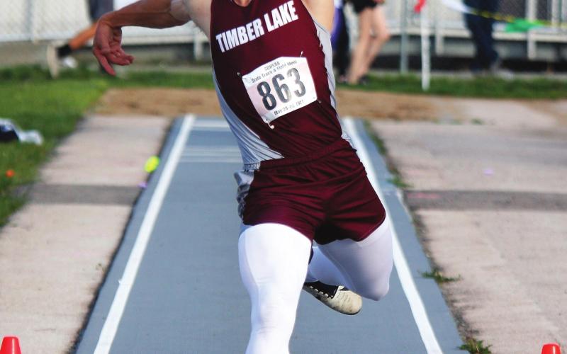 Timber Lake junior Hank Kraft makes a triple jump during the state meet last week. Photo by Ryan Deal, Mitchell Daily Republic