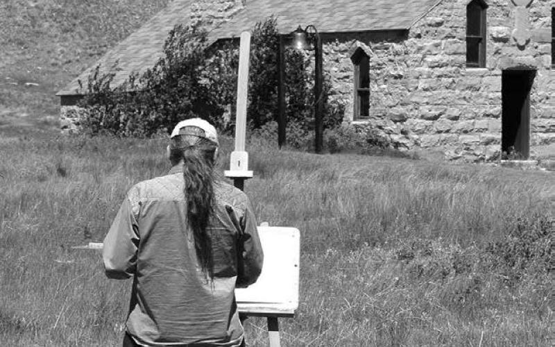 Standing Rock artist Del Iron Cloud, shown here painting the Old Stone Church on Firesteel Creek in 2012, will be the guest artist at the Timber Lake Museum during the Days of 1910, July 24 and 25.