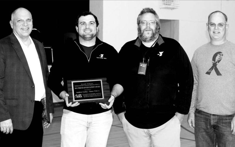 L-R are Loren Paul, SDEA president; Andrew Corley, Sioux YMCA CEO; Mark Barron, YMCA Senior Youth Involvement Director; and Shawn Olsen, who nominated the Sioux YMCA for the Friend of Education Award.