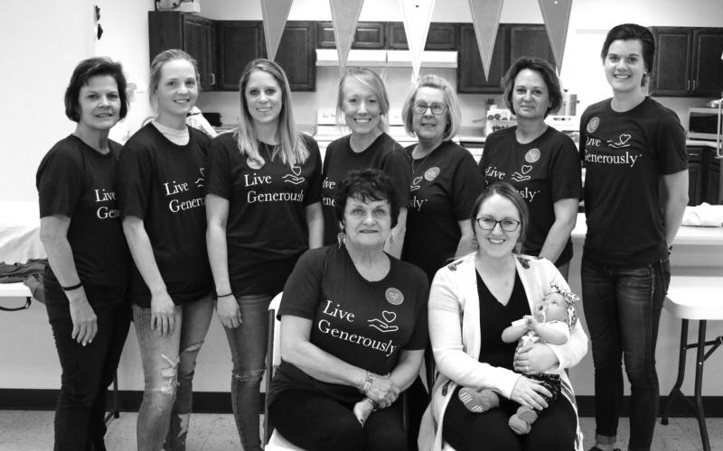 The group working to open a community day care center in McIntosh held a meatball dinner fundraiser in the McIntosh City Hall on Sunday, April 25, raising more than $1,700 toward the effort. Organizing and serving the meal were FRONT (L-R): Deb Nehl and Melissa Day holding baby Harper; BACK: Connie Maier, Annie Walker, Kelli Nehl, Kristy Seiler, Cathy Evans, Sandy Baumberger and Tia Nehl. Photo by Jon Flatland