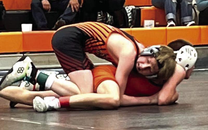 Taggen Paxton (top) works against an opponent during recent McLaughlin-Timber Lake wrestling action. Paxton won top honors at 100-103 pounds at the Ipswich-Bowdle JV Meet on Jan. 22. Photo by Denise Perryman
