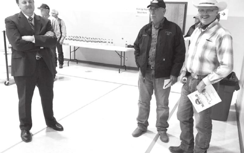 Moreau-Grand attorney John Burke (LEFT) talks with members Stuart Johnson and Bill Hahne.