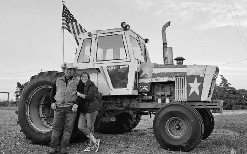 Oren and Tracy Lesmeister are displaying their Spirit of ‘76 tractor at their place on Highway 212.