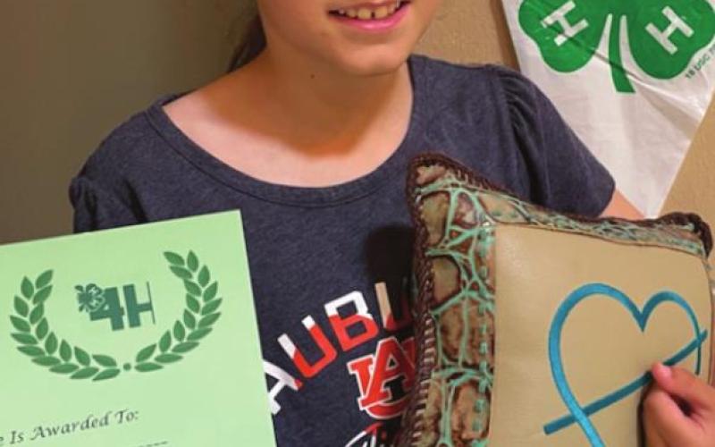 Bricelyn Pederson made a leather pillow as one of her 4-H projects. It received a purple ribbon.