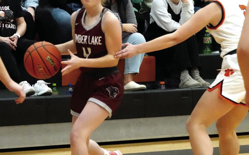 Panther guard Kenlea Heck, a 5-1 senior, surveys the floor while bringing the ball upcourt during action against the Faith Lady Longhorns last Tuesday, Jan. 2. Photo by Marie DuPreez