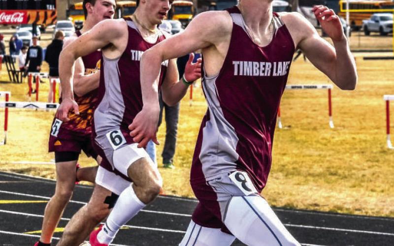 Panther sprinters Holden Gill (right) and Gavin Farlee (center) squared off against one another in recent track action. Farlee, a junior, claimed top honors in the 200 meter run and was third in the 100 meter race at the Northern Hills Invitational last week. Photo by Marie Du Preez