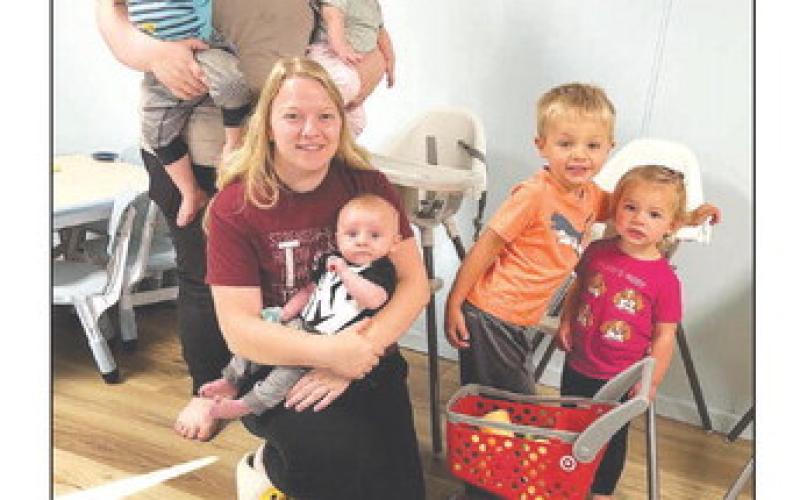 Tiny Tots Daycare opened August 12 at the home of Micaela and G.J. Castaneda. Pictured are (left) Micaela holding her two children, Kaius and Emelia; (middle) Jimi Lynn Hulm holding baby Hayes Hansen; and (right) Douglas and Reagan Kraft.