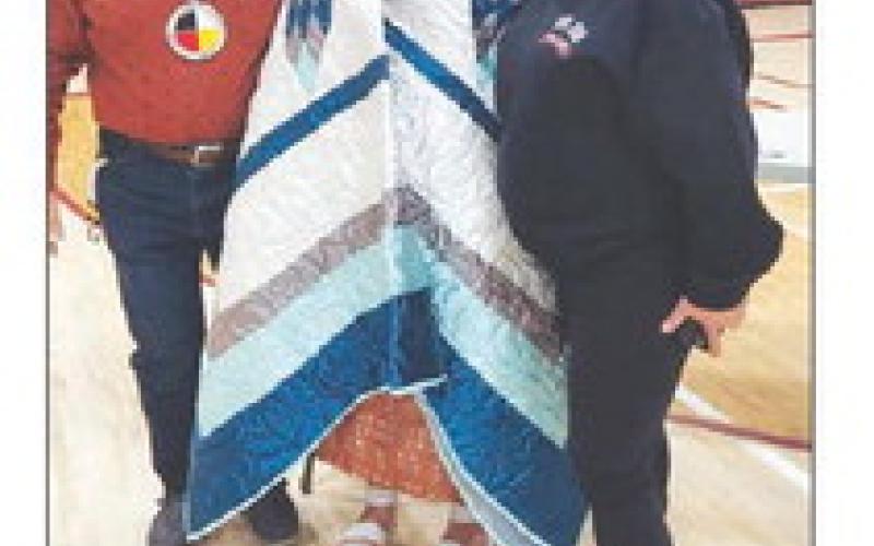 Kenna Webb with Greg Sherwood and Michealle Sherwood. (Kenna’s grandmother, Joan Webb, made the star quilt before her passing.)