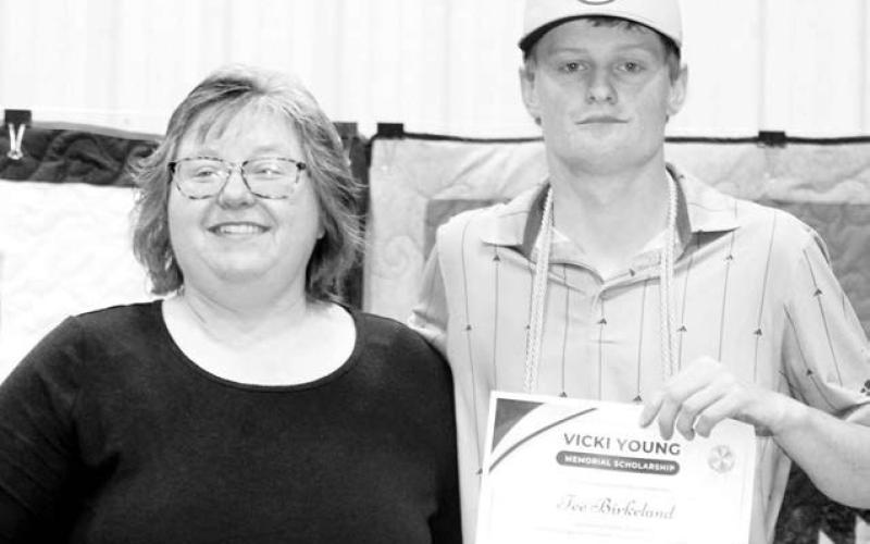 Susie De La Rosa presented this year’s Vicki Young Memorial Scholarship to Tee Birkeland. Photo by Patty Peacock