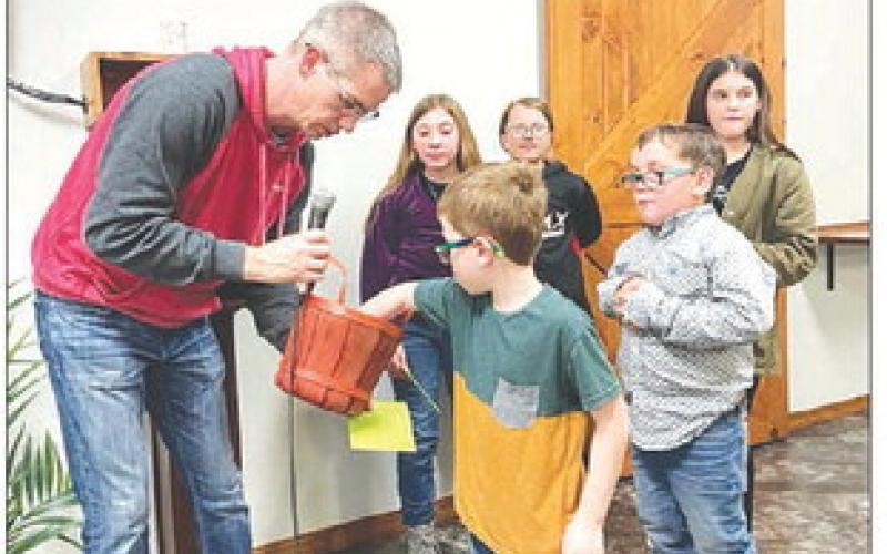 Door prize drawings were conducted by Pastor Bryce Schaffer with help from Waylon Maher and Joseph Bridges; and BACK (L-R) CeCe Cowan, Maya Biegler, and Kylee Lawrence.