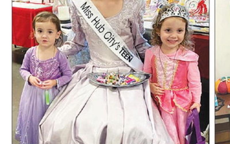 LEFT: Princess Natalie Biegler with the Schweitzer girls, Sawyer (LEFT) and Ellie, at the Trunk or Treat event.