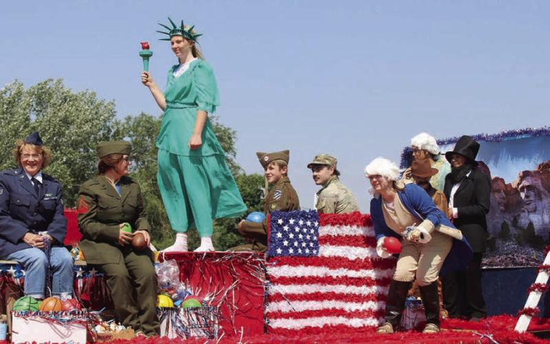 The first place winner in the theme relevancy category, the Western Dakota Bank float. On the float are (l-r) Karma Nash, Miranda Clarys, Tristan Swift, Luke Beer, Treyden Beer, Shayla Beer, Bryce Beer, Jasmine Nash, and Megan Mutchler. Photo by Patty Peacock