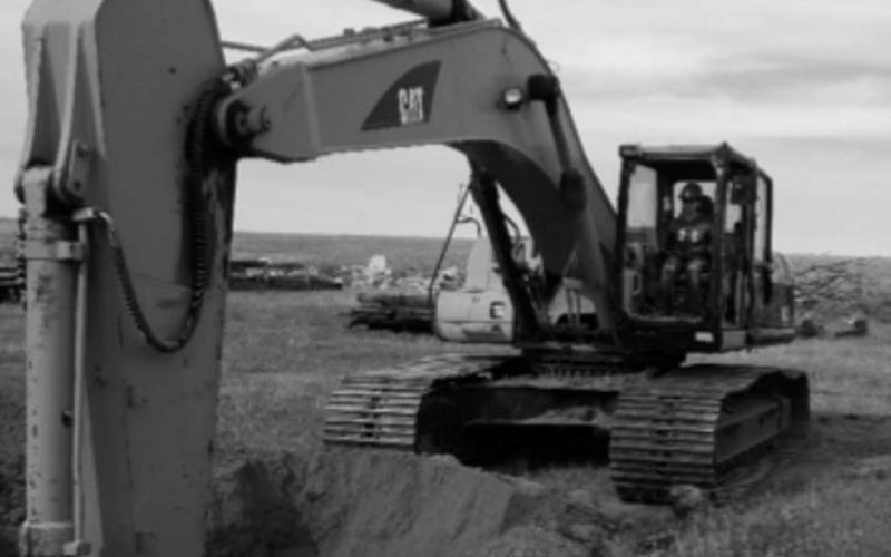 AT RIGHT: McIntosh student Hanna Nix operating an excavator. Students also learn to operate a bulldozer and wheel loader.