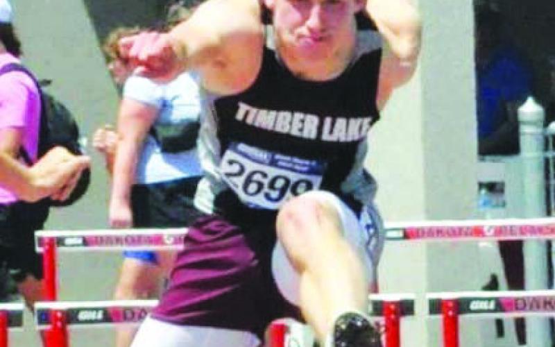 Timber Lake’s Gracen Hansen clears a hurdle during the State Class B Track meet in Sioux Falls last week. Hansen finished fifth overall in the 300 meter hurdles and was sixth in the triple jump. Photo by Mary Farlee