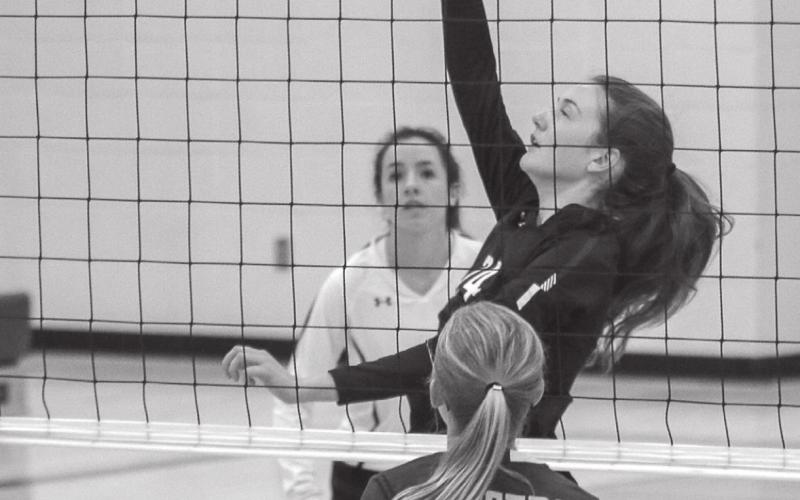 LEFT: Sara Holzer sends a spike over the net. Holzer has been contributing at the net for Timber Lake as the season has gone on. Photos by Jon Flatland