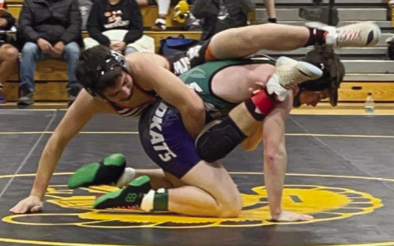 McLaughlin/Timber Lake’s Levi Berndt (top) tries to apply a leg scissor to an opponent at the Faulkton Wrestling Invitational on Saturday, Dec. 9. Photo courtesy of Denise Perryman