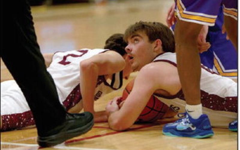 Treyden Beer looks up for a referee’s call after a scrum for a loose ball during Timber Lake’s meeting with New Underwood on Dec. 20. Topic Photo/Marie DuPreez