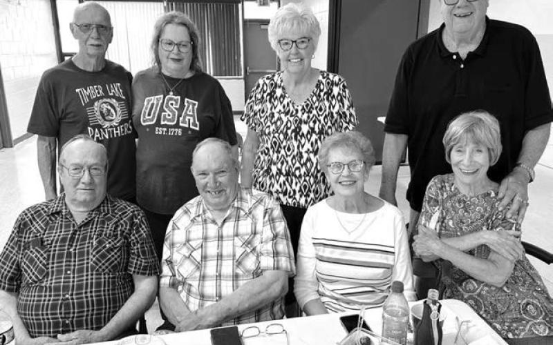 A small but enthusiastic group from the Timber Lake High School Class of 1961 had a reunion on July 25. Attending were (front, l-r) Dan Holzer, Bob Silbernagel (his wife, JoAnn, behind him), Bonnie McMacken Yuker, LarryTompkins and his wife Ann (in front); Back: Ken “Buddy”Paul and wife Lavonne. Photo by Kathy Nelson