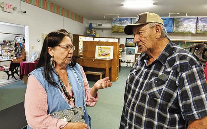 Danialle Rose of Hot Springs (LEFT) found the event an opportunity to talk with others to help with her historical research on the Diamond A Cattle Company. Frankie Thompson (RIGHT), who took part in the program when the White Horse Winter Count was first presented to the White Horse community in 2008, spoke at the grand opening.