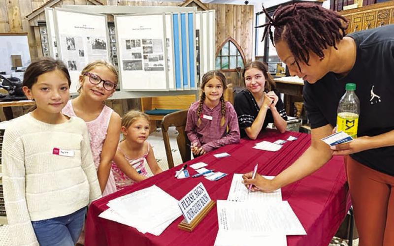 The welcoming committee asked guests to sign in and take a name tag. L-R are Haylee Thompson, Sophia Gross, Tessa O’Leary, Ada O’Leary and Natalie Gross.