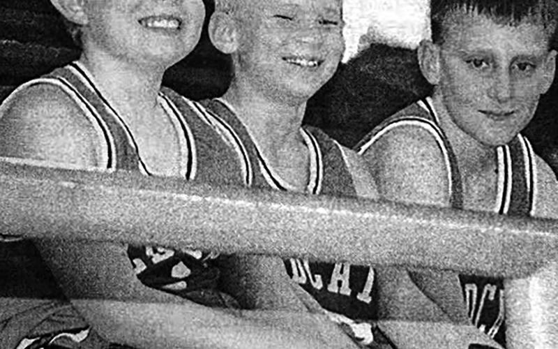 With one win under their belt and anticipating their next game, friends Sean Meginness, William Orndorff and Kilby Rech relax during the triangular with Bison and Timber Lake played at Isabel Monday, Dec. 1. Isabel Dakotan, December 4, 2003