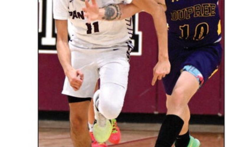 Timber Lake senior Tristan Dupris (11) is fouled by Dupree’s Jayden Taken Alive (10) during non-conference boys basketball action earlier this season. The Panthers close out their regular season schedule on Friday Feb. 23, against Potter County in Gettysburg. Photo by Marie Du Preez