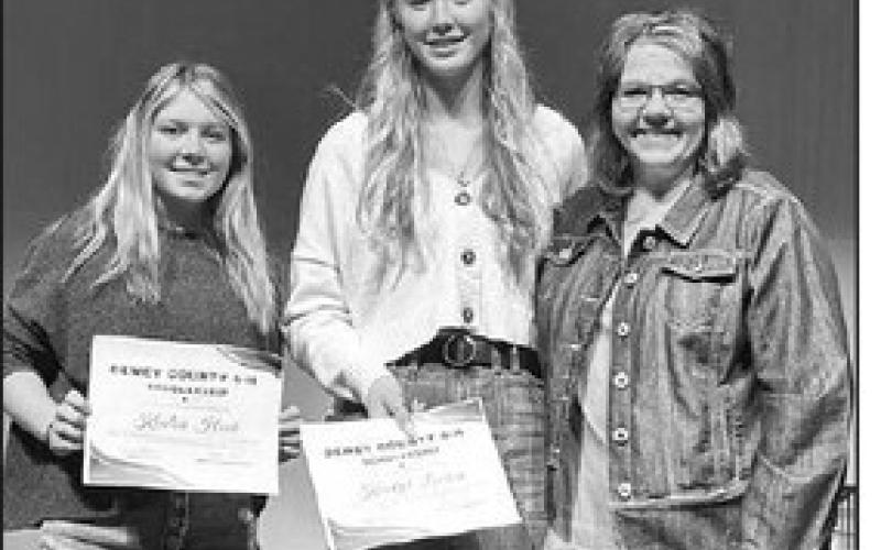 Dewey Co. 4-H Advisor Rita Long (RIGHT) presented $250 4-H scholarships to Kenlea Heck (LEFT) and Kendyl Locken.