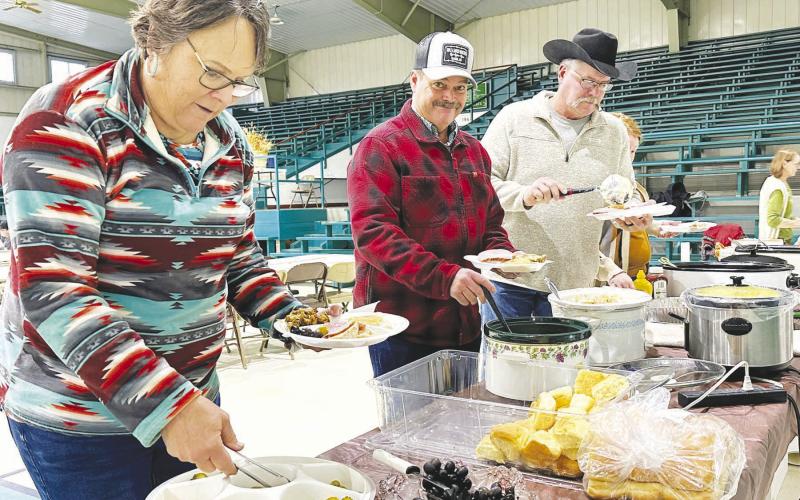 The Isabel Community Center was filled with the smell of great food and the sound of great fellowship on Sunday, Nov. 3, during the Prairie Parsish Churches annual Fall Festival. Among those enjoying turkey, ham and more were (l-r) Laurie and Bill Bickel and Jeff Stradinger. Silent and live auctions were held following the meal. Photo by Kathy Nelson