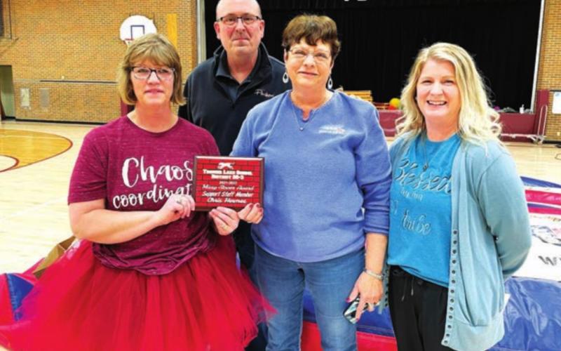Administrative Assistant Chris Hermes received one of three Missy Stover Awards. L-R are MS/HS Principal Julie Mashall, Supt. Dan Martin, Chris, and Elementary Principal Danae Paxton.
