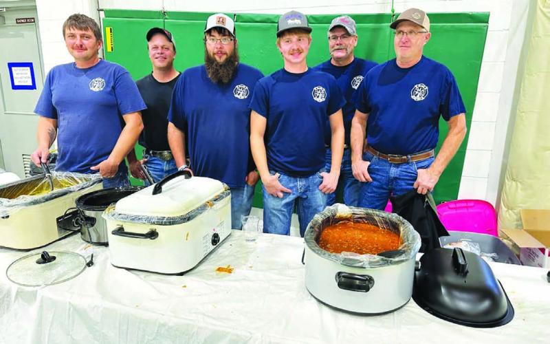 Serving up homemade chili and chicken noodle soup are Isabel Volunteer Firefighters L-R: Brent Spafford, Tony Russell, Patrick Bridges, Riley Lindskov, Lynn Stradinger, and Bill Lindskov.