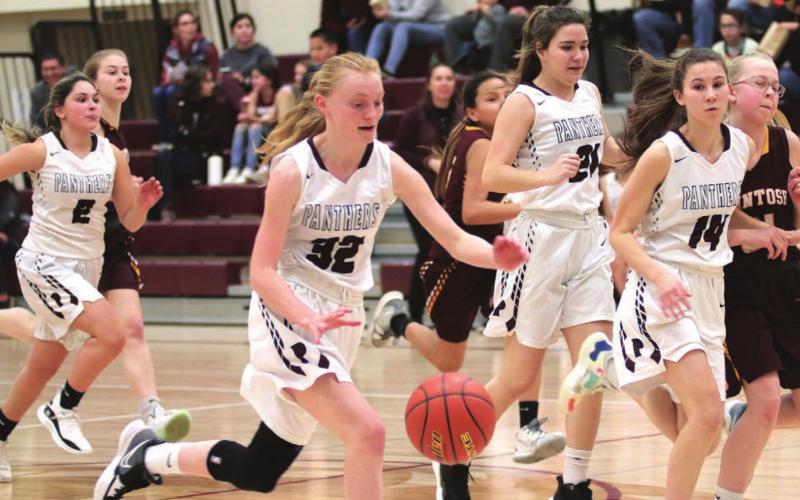 Panthers on the fast break (L-R) versus McIntosh: Joie LeBeau (2), Jordan Jones (32), Abby Linderman (21) and Natalie Lawrence (14). Photos by Jon Flatland