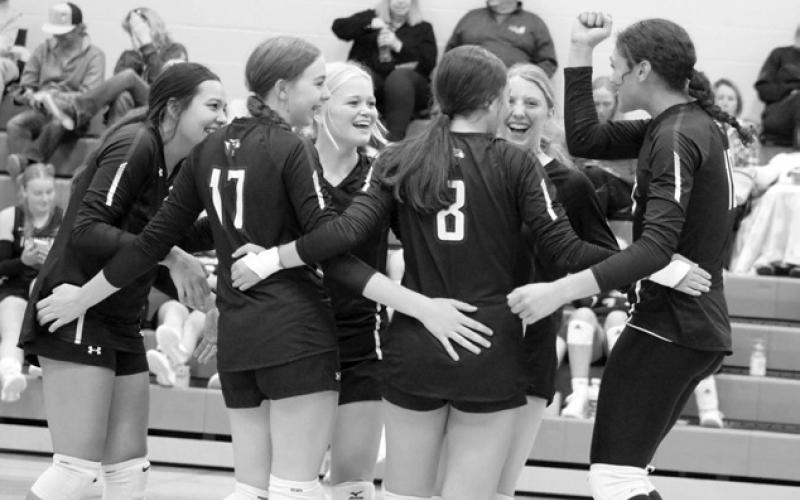 The Panthers celebrate winning a point after a hard-fought volley against Herreid-Selby in their first match at the Subway Volleyball Invitational held Saturday, Sept. 21, in Ipswich. Pictured l-r are Kessa Bigger, Geana Bollinger (17), Hailey Roggow, Jaylee Schoelerman (8), Sara Keller and Jasmine Nash. Photo by Jon Flatland
