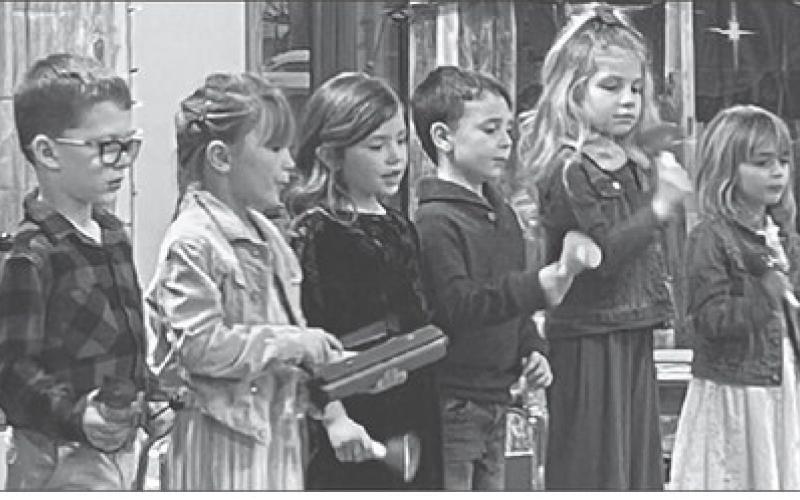 Kindergartners sang and played instruments. L-R are Lincoln Aberle, Clara Nilson, Brie Parker, Paxton Schweitzer, Rose Maher, and Harper Biegler.