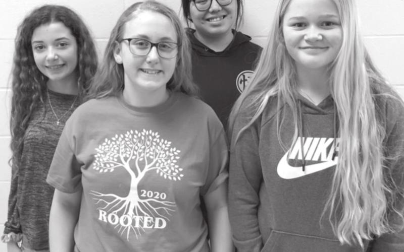 SEVENTH GRADE SPELLERS. FRONT (L-R): Emma Johnston and Hailey Roggow (winners); BACK: Arianna Bieber and Ikeah Buckley (alternates).