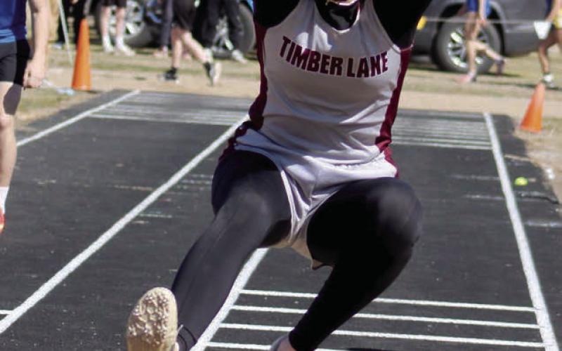 Junior triple jumper Sara Keller comes in for a landing at the Mobridge-Pollock Early Bird Track Meet in Mobridge last Thursday, April 10. Keller claimed top honors in the event with a mark of 33-0.25 and helped the Panther girls to a second place finish in the team standings. Photo by Jon Flatland