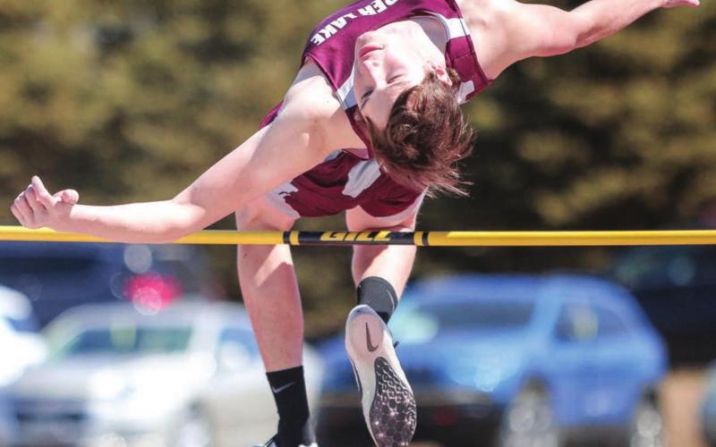 Timber Lake senior Dixon Booth clears the bar during the boys high jump event at the Timber Lake tune-up meet held last week at Doug Kraft Field. Photo by Jon Flatland