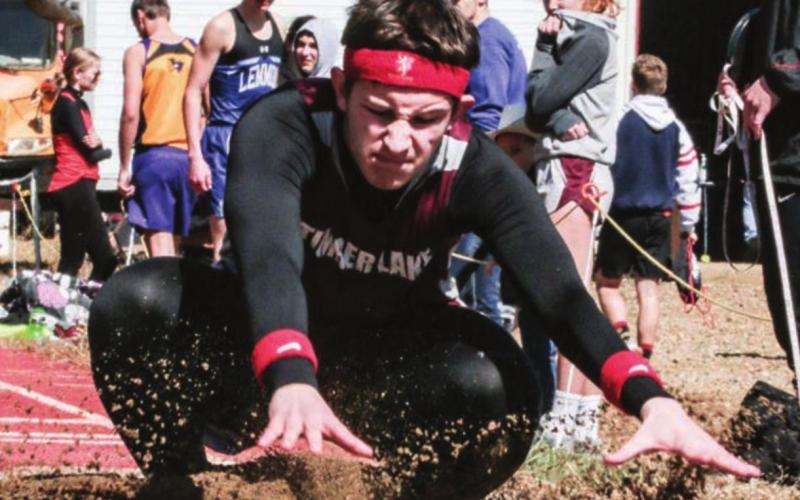 Timber Lake’s Landon Lemburg touches down after his best leap in the long jump.