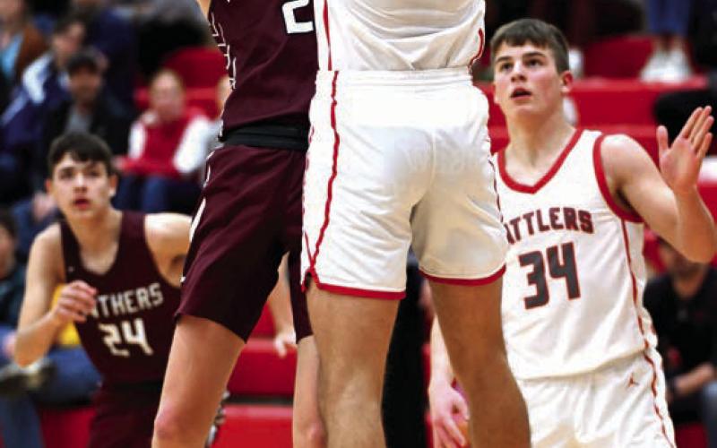 Timber Lake senior Kyler Bollinger puts a shot over the outstretched arms of a Potter County defender during the Panthers’ matchup with Potter County last Friday, Feb. 23. Bollinger finished the contest with five points. Timber Lake tipped off the Region 8B Boys Basketball Tournament on Tuesday facing Takini in the first round. Photo by Marie Du Preez