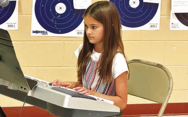 Ada O’Leary presented a musical number and received a blue ribbon from the judge. Photos by Kathy Nelson