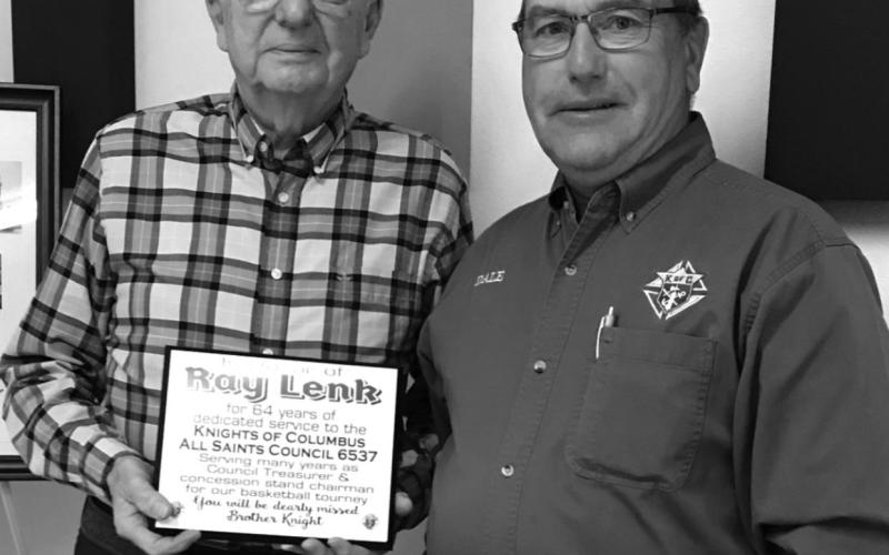 Dale McLellan (RIGHT) presented Ray Lenk with a plaque recognizing his many years of service to the Knights of Columbus. Photo by Vicki Schilling