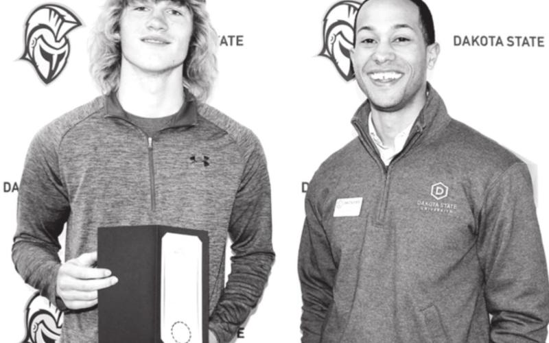 Chase Marshall (LEFT) has been awarded the Presidential Champion Scholarship from Dakota State University. DeVonté Garcia (RIGHT), Assistant Director of Development, presented the award at Champion Scholar Registration Day at DSU.