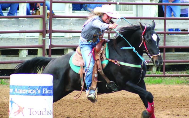 (Left) Charly Etzkorn of Dupree leads her horse around a barrel during the SDHSRA’s Northwest Region Rodeo in Dupree. Etzkorn missed the cut to qualify for state in barrels, but advances to compete in girls cutting, team roping and goat tying. Photos by Jon Flatland