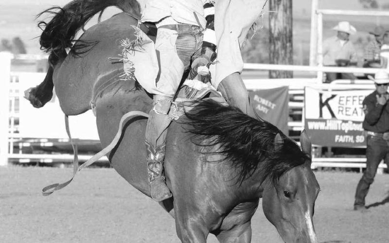 Cayden Wolfe of Faith was among the saddle bronc riders competing at the annual Faith Stock Show and Rodeo last week. Photo by Jon Flatland