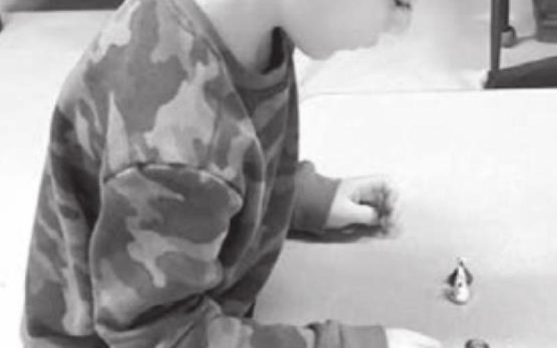 Stetson Schweitzer is counting the kisses he found on the 100th day of school.