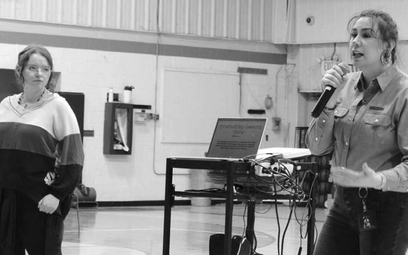 Alex Peterson (L) and Tayzia Claymore Knight (R), from the Sacred Heart Center, presenting to the Dupree students about the dangers of online stalking.